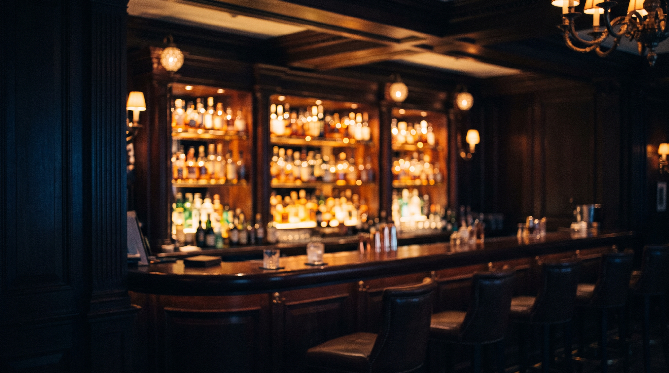Dimly lit London hotel bar before a private evening engagement.
